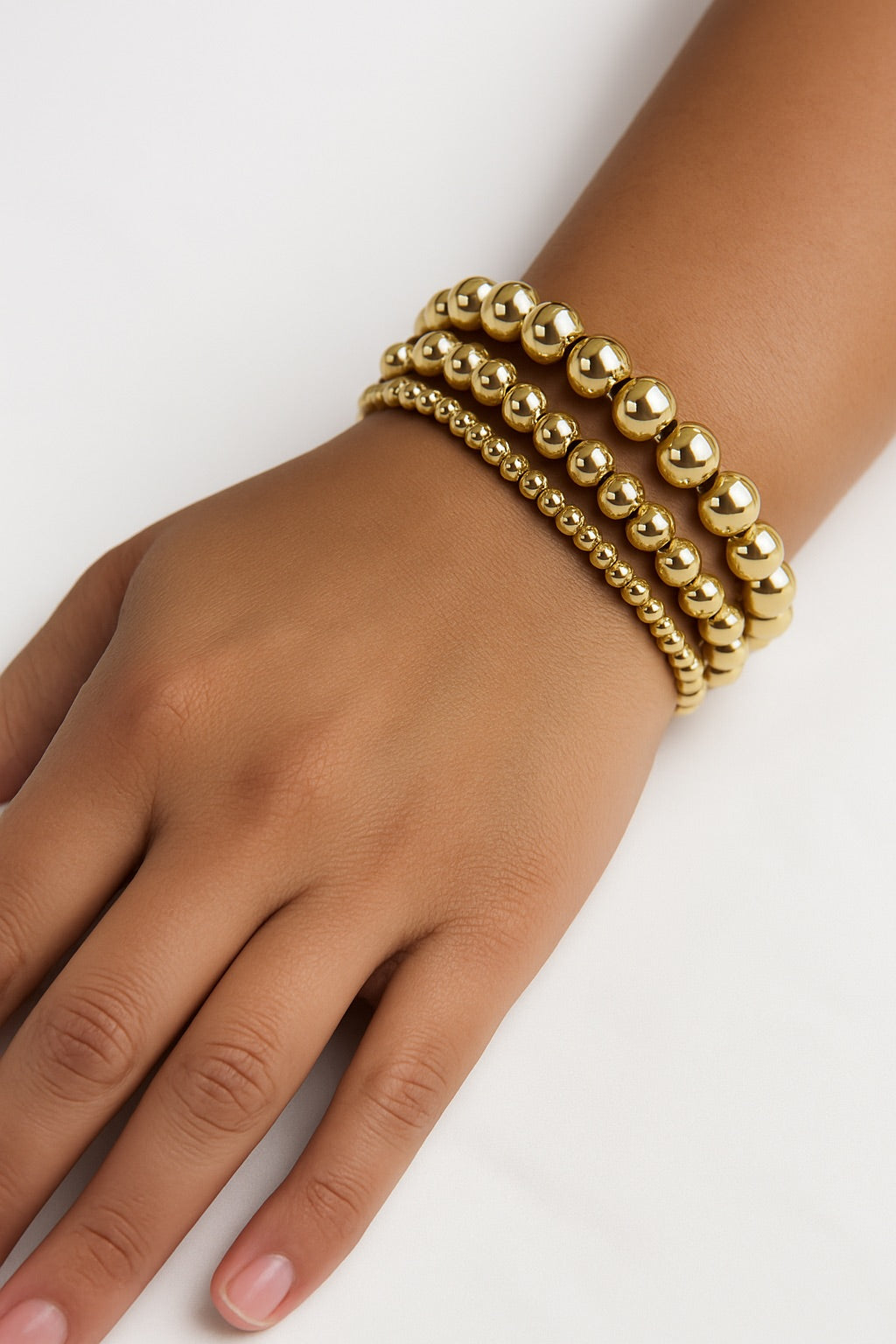 Set de pulseras doradas