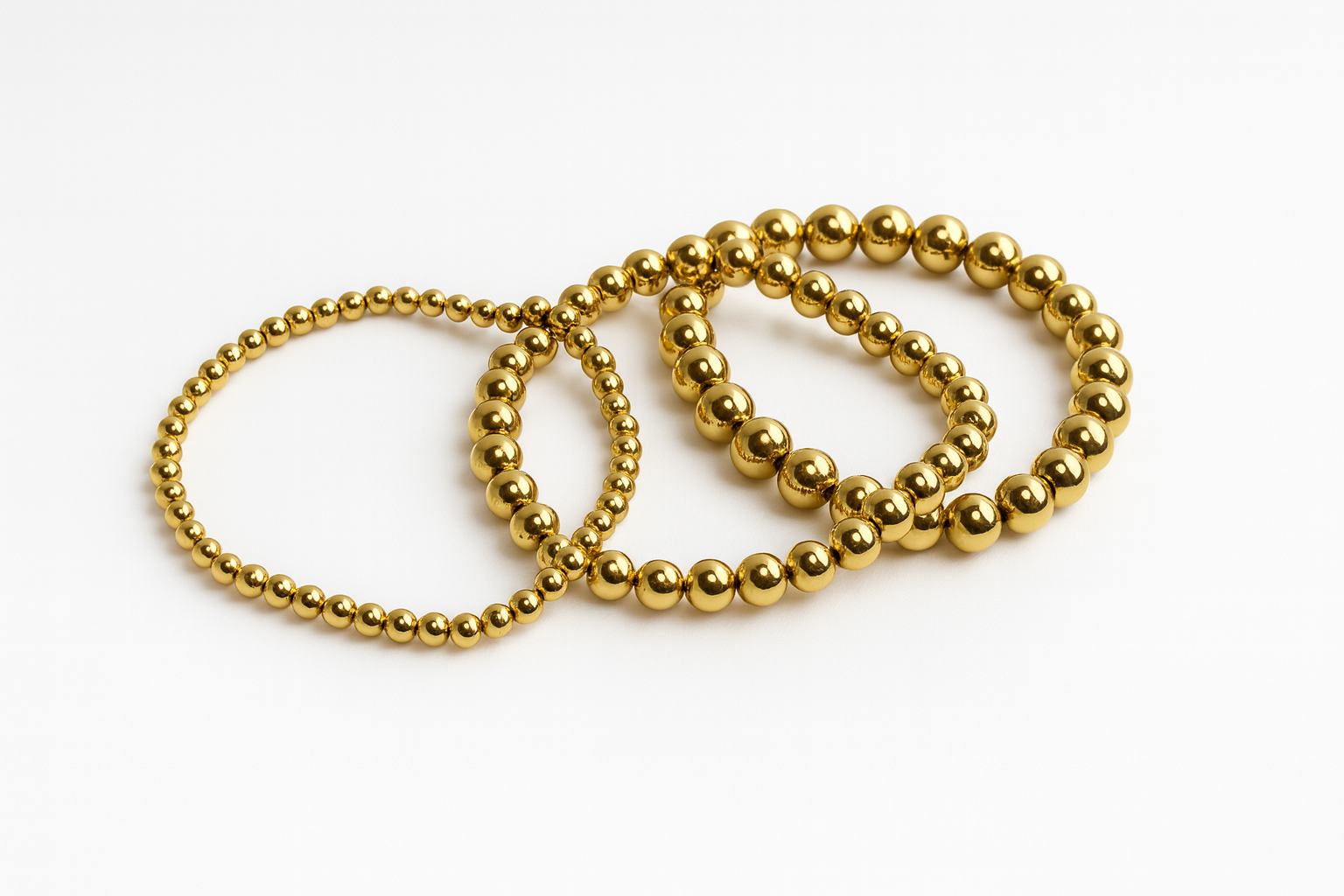Set de pulseras doradas